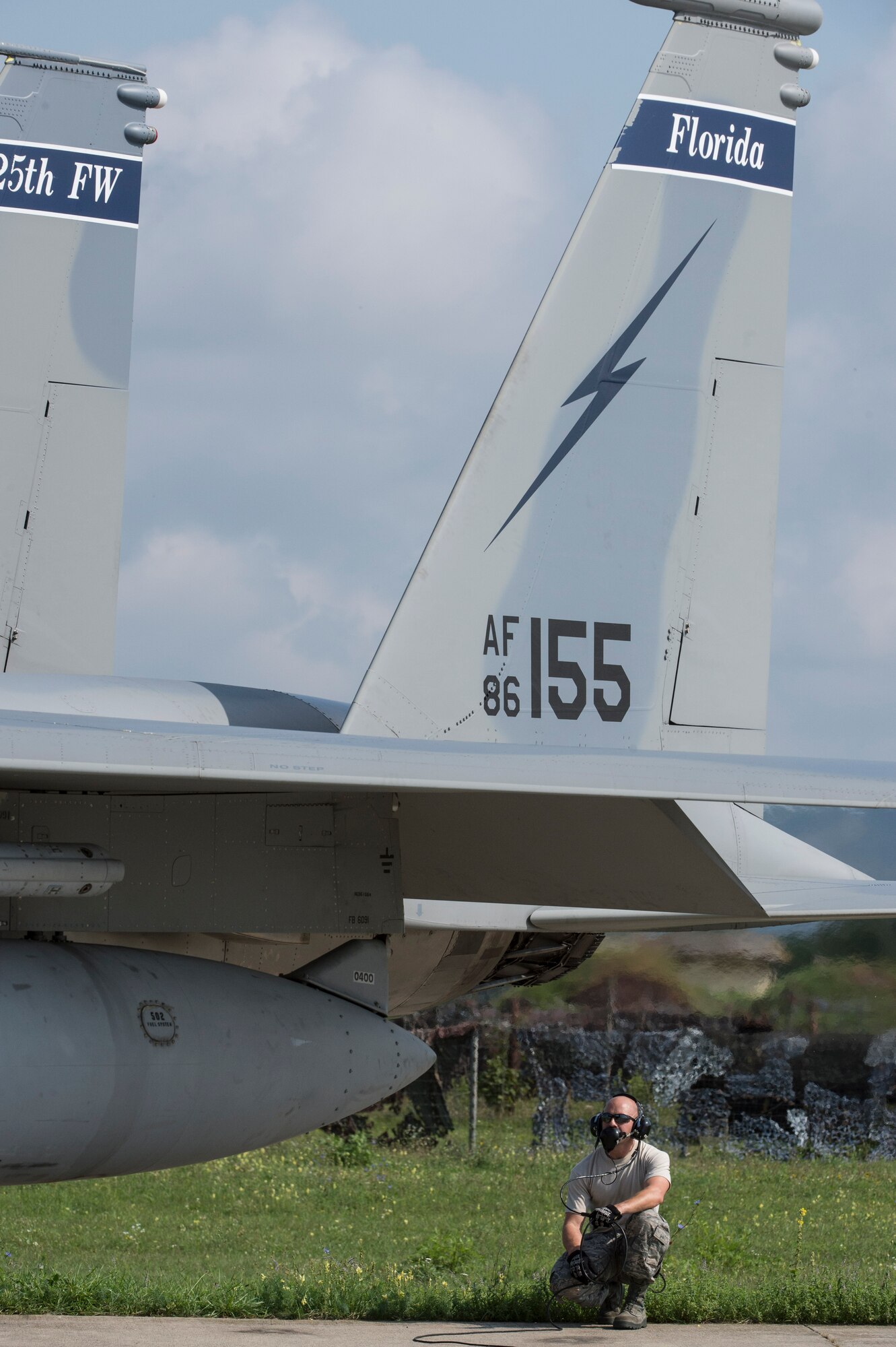 A crew chief from the 123rd Expeditionary Fighter Squadron, 142nd Fighter Wing, Oregon Air National Guard, performs pre-flight checks on an F-15C Eagle fighter aircraft during a theater security package deployment Sept. 25, 2015, at Campia Turzii, Romania. The U.S. Air Force’s forward presence in Europe allows cooperation among NATO allies and partners to develop and improve ready air forces capable of maintaining regional security. (U.S. Air Force photo by Staff Sgt. Christopher Ruano/Released)