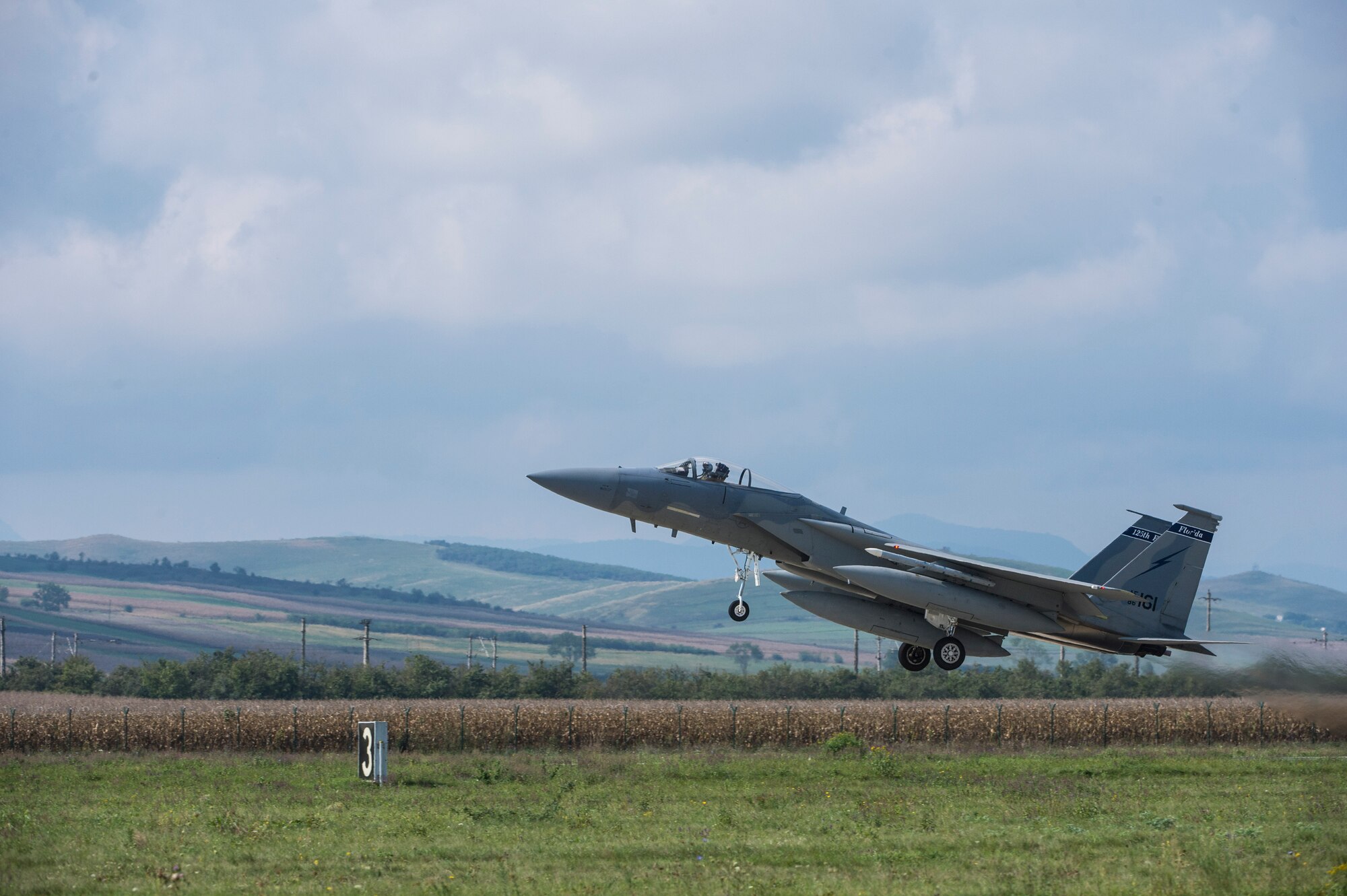 An F-15C Eagle fighter aircraft pilot assigned to the 123rd Expeditionary Fighter Squadron, 142nd Fighter Wing, Oregon Air National Guard, takes off during a theater security package deployment Sept. 25, 2015, at Campia Turzii, Romania. These deployments send a clear message to the international community that the U.S. is serious about security and stability in the region. (U.S. Air Force photo by Staff Sgt. Christopher Ruano/Released)