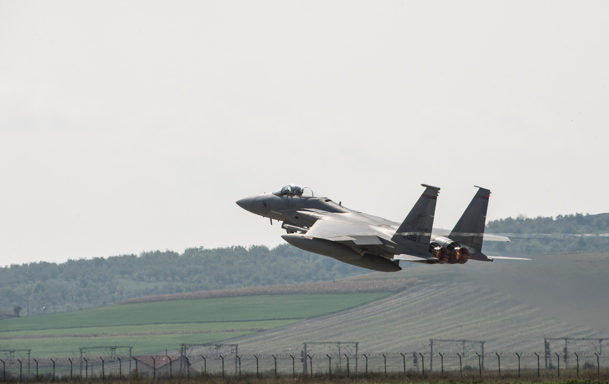 An F-15C Eagle fighter aircraft pilot assigned to the 123rd Expeditionary Fighter Squadron, 142nd Fighter Wing, Oregon Air National Guard, takes off during a theater security package deployment Sept. 25, 2015, at Campia Turzii, Romania. The pilots conducted training alongside NATO allies to strengthen interoperability and demonstrate U.S. commitment to the security and stability of Europe. (U.S. Air Force photo by Staff Sgt. Christopher Ruano/Released)