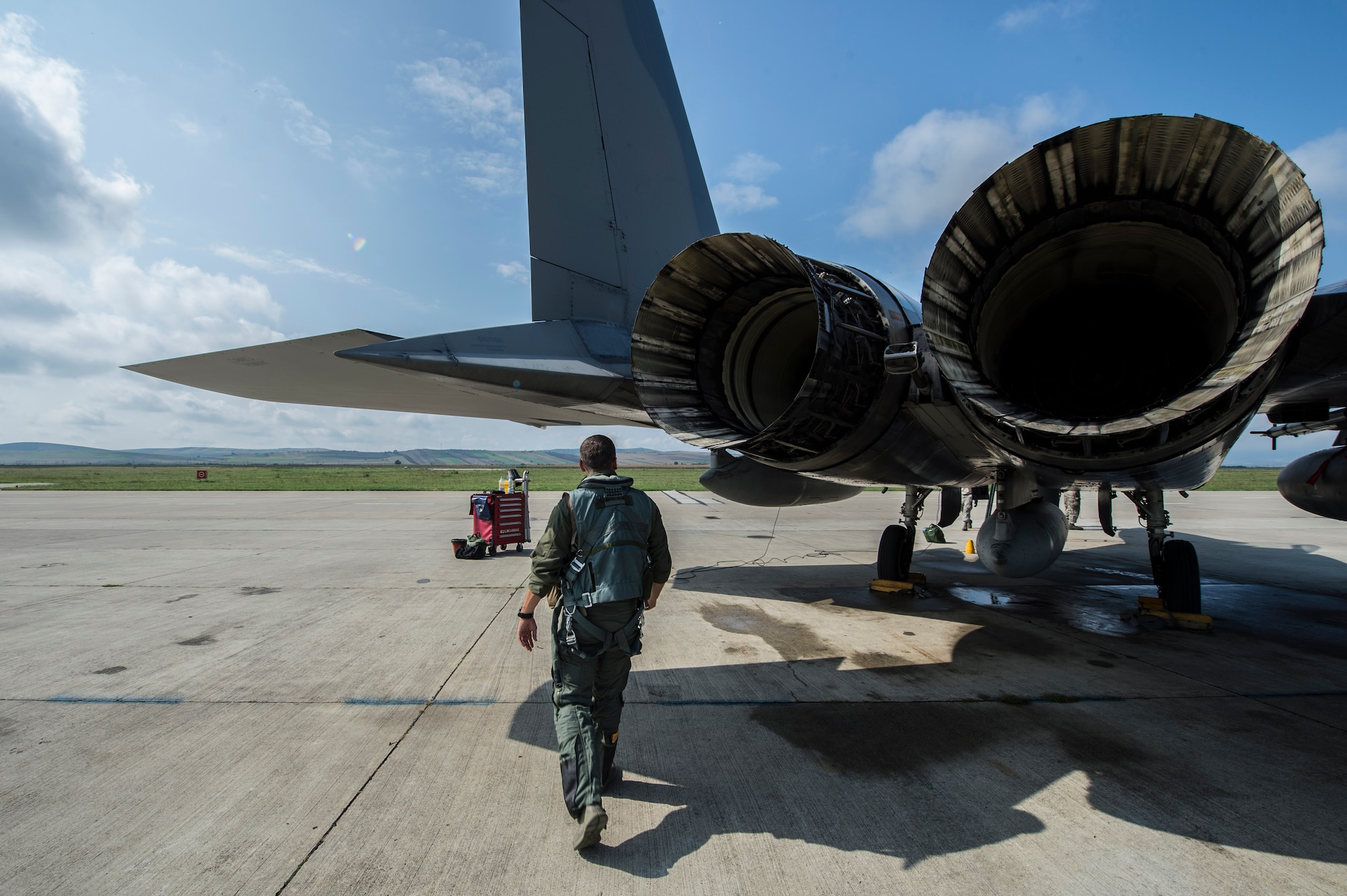 An F-15C Eagle fighter aircraft pilot assigned to the 123rd Expeditionary Fighter Squadron, 142nd Fighter Wing, Oregon Air National Guard, does a walk around his aircraft during a theater security package deployment Sept. 25, 2015, at Campia Turzii, Romania. The aircraft deployed to Romania in support of Operation Atlantic Resolve to bolster air power capabilities while underscoring the U.S. commitment to European security and stability. (U.S. Air Force photo by Staff Sgt. Christopher Ruano/Released)