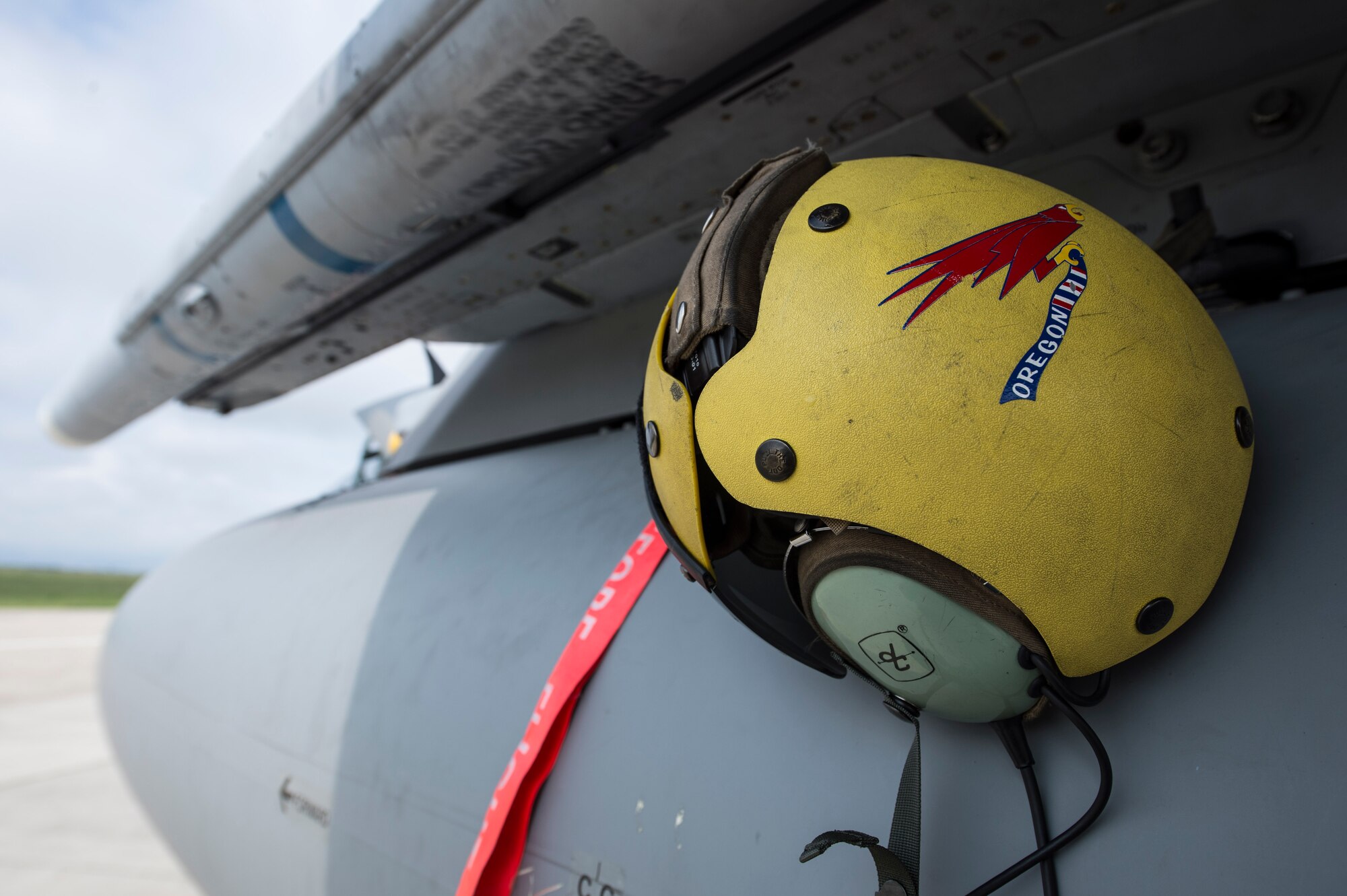 A 123rd Expeditionary Fighter Squadron, 142nd Fighter Wing, Oregon Air National Guard crew chief helmet hangs on an F-15C Eagle fighter aircraft during a theater security package deployment Sept. 25, 2015, at Campia Turzii, Romania. U.S. Air Force Airmen and support equipment from the 142nd FW and the 52nd Fighter Wing at Spangdahlem Air Base, Germany, supported this deployment. (U.S. Air Force photo by Staff Sgt. Christopher Ruano/Released)