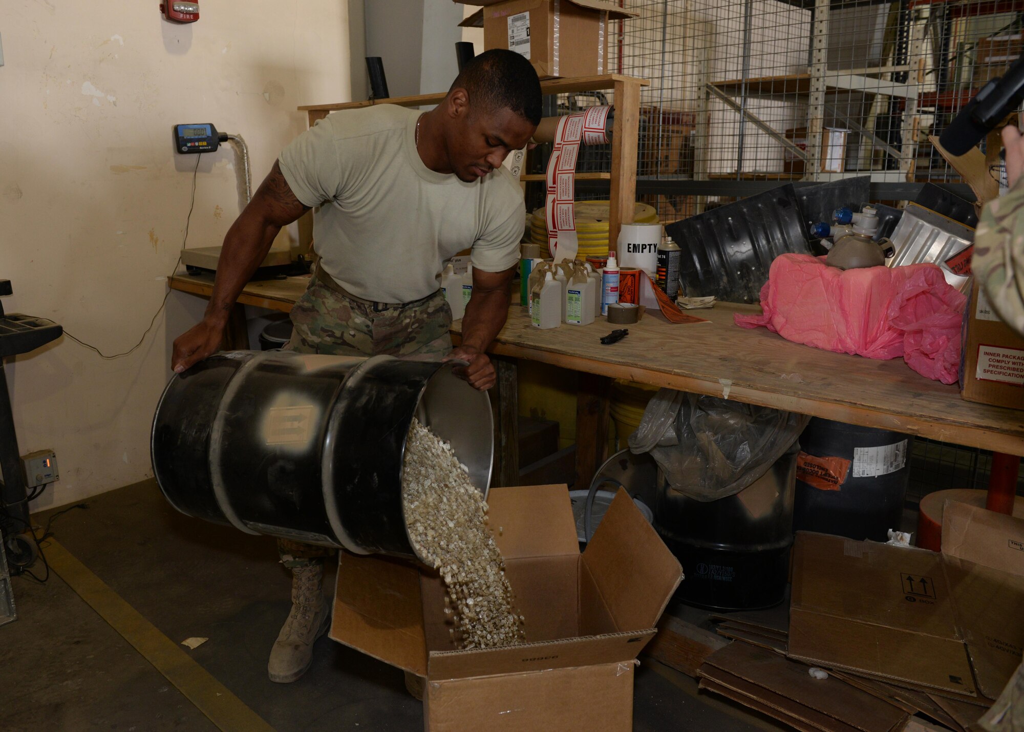 U.S. Air Force Senior Airman Kionne Lewis, 455th Expeditionary Logistics Readiness Squadron Traffic Management Office cargo movement specialist, prepares material for shipment Sept. 24, 2015, at Bagram Airfield, Afghanistan. Lewis is responsible for ensuring all shipments from the Area of Responsibility, to include hazardous and classified materials as well as aircraft parts, are ready for transport. (U.S. Air Force photo by Senior Airman Cierra Presentado/Released)