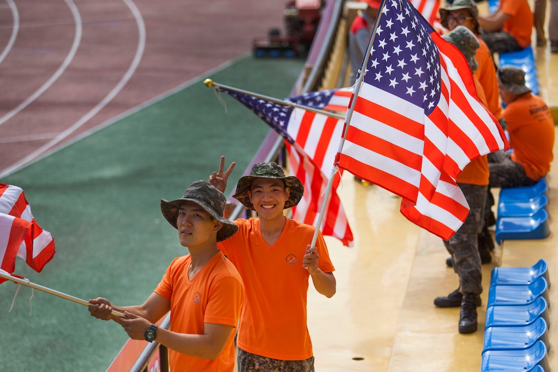 South Korean military member support the U.S. men's soccer team during their first round in the 6th CISM Military World Games in Mungyeong, South Korea, Sept. 30, 2015. The CISM World Games allows athletes from more then 100 countries to come together in friendship through sports. The 6th CISM Military World Games are being held in Mungyeong, South Korea, through Oct. 11. U.S. Marine Corps photo by Cpl. Jordan Gilbert
