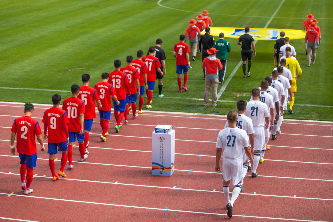U.S. and South Korean men's soccer teams enter the field to kick off the first round game in the 6th CISM Military World Games in Mungyeong, South Korea, Sept. 30, 2015. U.S. Marine Corps photo by Cpl. Jordan Gilbert