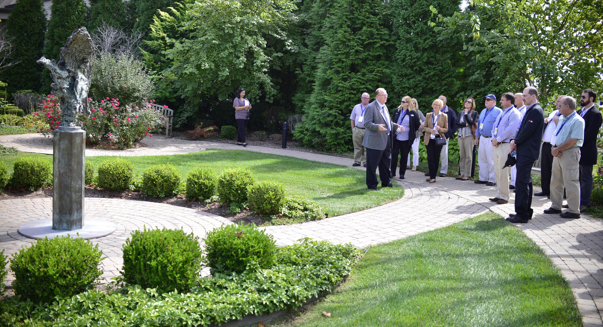 David Sparks, Senior Mortuary Chaplain at Dover Air Force Base, Del., leads a tour of civilian employers from Western New York through the Memorial Garden on Sept. 24, 2015, as part of a boss lift from Niagara Falls Air Reserve Station, N.Y. The tour was organized through the Employer Support of the Guard and Reserve, aimed to thank and educate civilian employers in Western New York who have shown support for their Military employees. (U.S. Air Force photo by Tech. Sgt. Stephanie Sawyer)