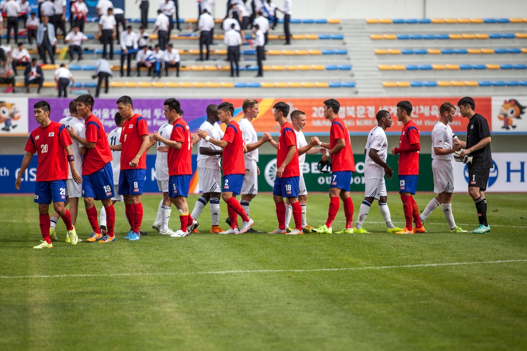 The U.S. men's soccer team and the South Korean men's soccer team shake hands after a soccer game during the first round of the 6th CISM Military World Games in Mungyeong, South Korea, Sept. 30, 2015. U.S. Marine Corps photo by Cpl. Jordan Gilbert