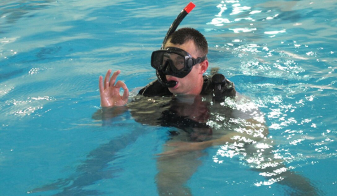 An Army dive school recruit gives the OK sign during one of the Phase 1 drills.