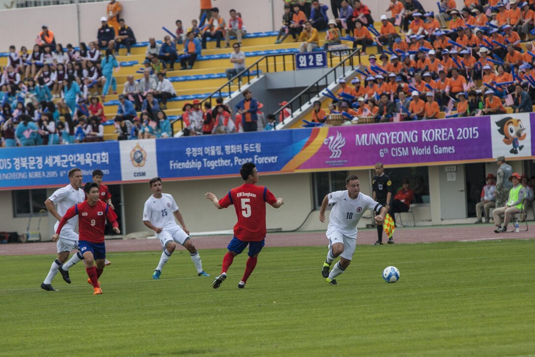 U.S. Men’s soccer team player Andrew Hyres, right, steals the ball from a South Korean men’s soccer player during the first round of the 6th CISM Military World Games in Mungyeong, South Korea, Sept. 30, 2015. U.S. Marine Corps photo by Sgt. Ashley Cano