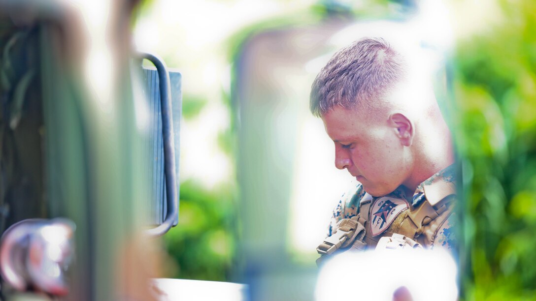 Lance Cpl. Quinn Dupraw, a field radio operator with 3rd Battalion, 3rd Marine Regiment, and Westland, MichIgan., native, stands by to leave with the forward operating group at the Boondocker Training Area aboard Marine Corps Base Hawaii during training exercise Island Viper, Sept. 22, 2015. The purpose of Island Viper was to help companies within the battalion ensure their service members have been properly trained and have met all training requirements before deployment. 