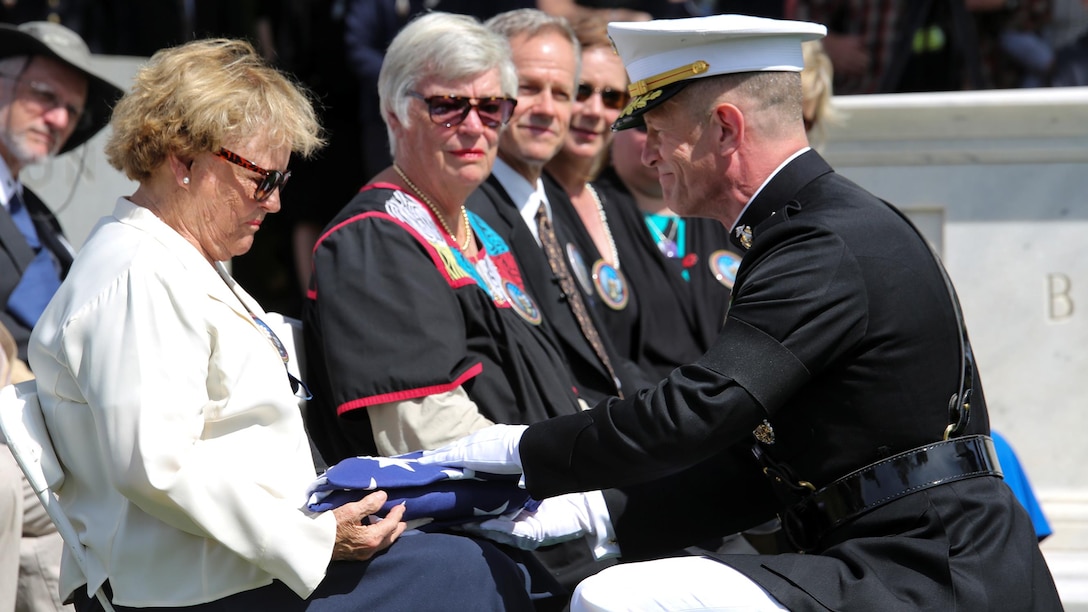 Maj. Gen. Burke Whitman, Headquarters Marine Corps director of Marine and family readiness, presents the American flag to the family of 1st Lt. Alexander Bonnyman Jr. at Berry Highland Memorial Cemetery in Knoxville, Tenn., Sept. 27, 2015. Bonnyman joined Marine Forces Reserve in July 1942 and was killed while fighting in the battle of Tarawa in 1943. Bonnyman’s remains were discovered in Tarawa 72 years after he was buried there. 