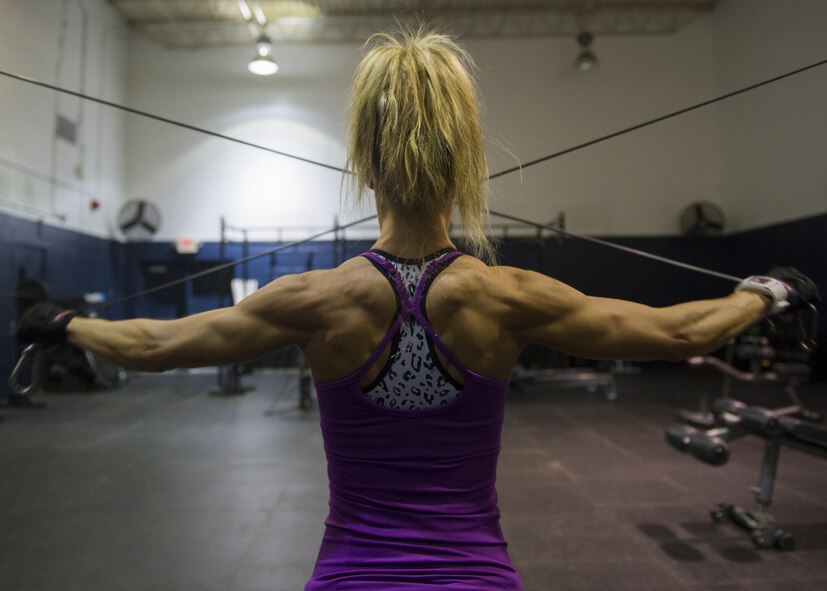 Airman 1st Class Paige Ryser, National Air and Space Intelligence Agency personnel specialist, trains Friday, Sept. 18, 2015 at the Wright Field Fitness Center. Ryser has been a motivation to her co-workers while preparing for her bodybuilding competitions. She works out six days per week and includes lifting, cardio and sprints in her workout routine, along with a strict diet program. (U.S. Air Force photo by Senior Airman Justyn Freeman)