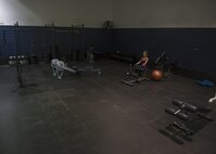 Airman 1st Class Paige Ryser, National Air and Space Intelligence Agency personnel specialist, trains Friday, Sept. 18, 2015 at the Wright Field Fitness Center. Ryser is often the only one lifting weights at 4 a.m. while preparing for her bodybuilding competitions. She works out six days per week and includes lifting, cardio and sprints in her workout routine, along with a strict diet program. (U.S. Air Force photo by Senior Airman Justyn Freeman)