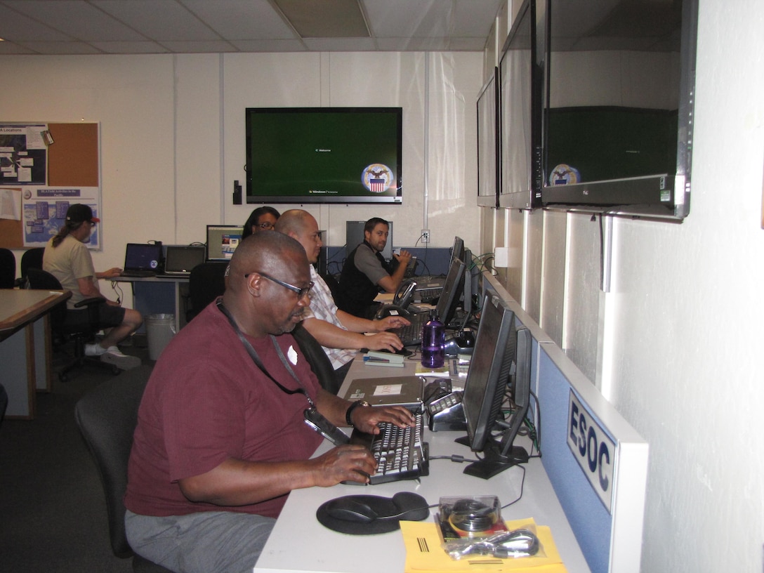 Members of the ESOC team work together to fulfill emergent materiel release orders to the Warfighter during an installation-wide communications outage.