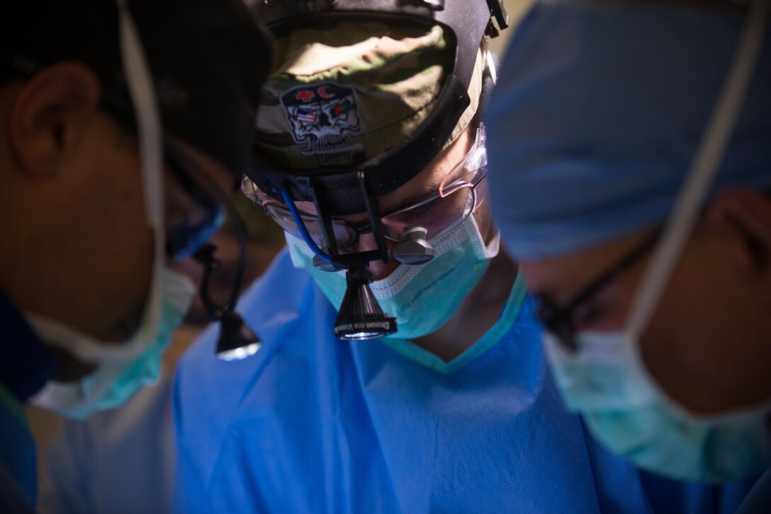 U.S. Air Force Maj. Stephen Varga, 455th Expeditionary Medical Group trauma czar, performs surgery on an Afghan National Defense and Security Forces soldier who sustained trauma from a gunshot at the Craig Joint Theater Hospital, Bagram Airfield Afghanistan, Sept. 26, 2015. The CJTH provides surgical capabilities in trauma, general surgery, orthopedics, neurosurgery, urology, vascular surgery and otolaryngology, all of which are critical to helping 98 percent of patients who come to the hospital survive their injuries. (U.S. Air Force photo by Tech. Sgt. Joseph Swafford/Released)
