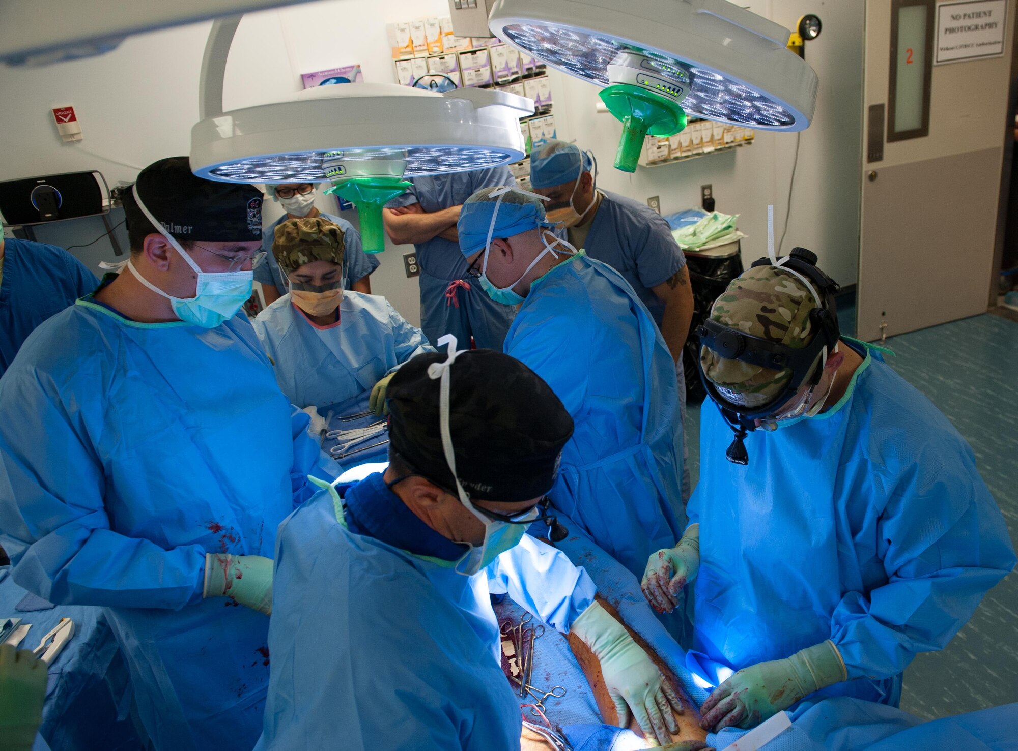 U.S. Airmen assigned to the 455th Expeditionary Medical Group perform surgery for gunshot trauma on an Afghan National Defense and Security Forces soldier at the Craig Joint Theater Hospital, Bagram Airfield Afghanistan, Sept. 26, 2015. The CJTH provides surgical capabilities in trauma, general surgery, orthopedics, neurosurgery, urology, vascular surgery and otolaryngology, all of which are critical to helping 98 percent of patients who come to the hospital survive their injuries. (U.S. Air Force photo by Tech. Sgt. Joseph Swafford/Released)