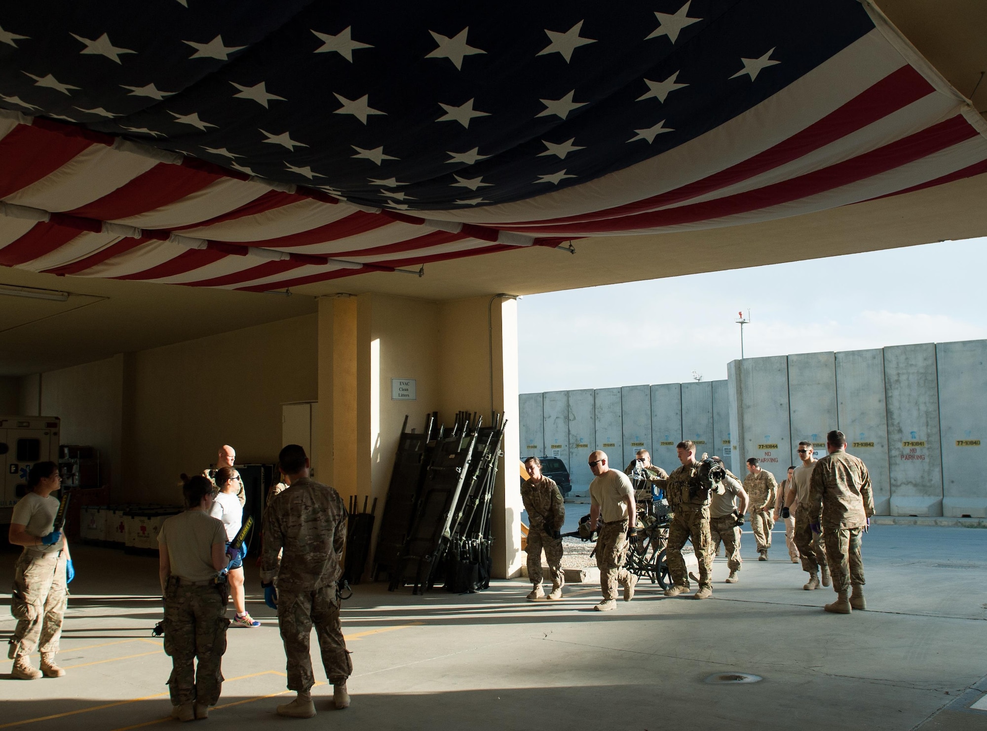 U.S. Airmen and Soldiers transport an injured Afghan National Defense and Security Forces soldier who sustained trauma from a gunshot to the Craig Joint Theater Hospital for surgery at Bagram Airfield Afghanistan, Sept. 26, 2015. The CJTH provides surgical capabilities in trauma, general surgery, orthopedics, neurosurgery, urology, vascular surgery and otolaryngology, all of which are critical to helping 98 percent of patients who come to the hospital survive their injuries. (U.S. Air Force photo by Tech. Sgt. Joseph Swafford/Released)