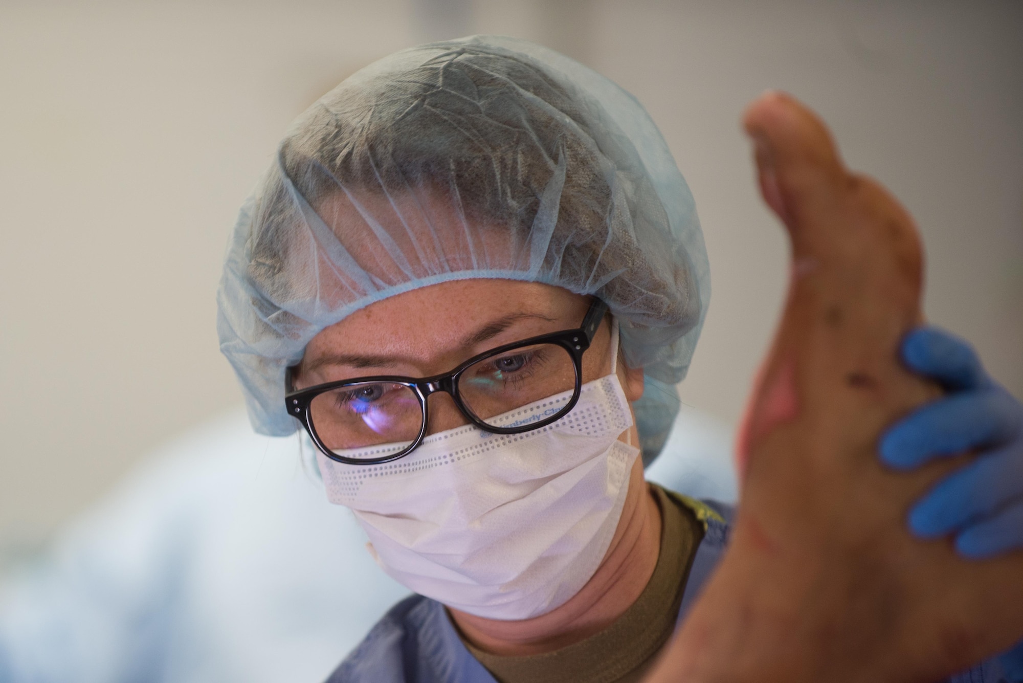 German Air Force Hauptfeldwebel Manuela Kaleb, operating room technician, prepares an Afghan National Defense and Security Forces soldier who sustained trauma from a gunshot for surgery at the Craig Joint Theater Hospital, Bagram Airfield Afghanistan, Sept. 26, 2015. The CJTH provides surgical capabilities in trauma, general surgery, orthopedics, neurosurgery, urology, vascular surgery and otolaryngology, all of which are critical to helping 98 percent of patients who come to the hospital survive their injuries. (U.S. Air Force photo by Tech. Sgt. Joseph Swafford/Released)