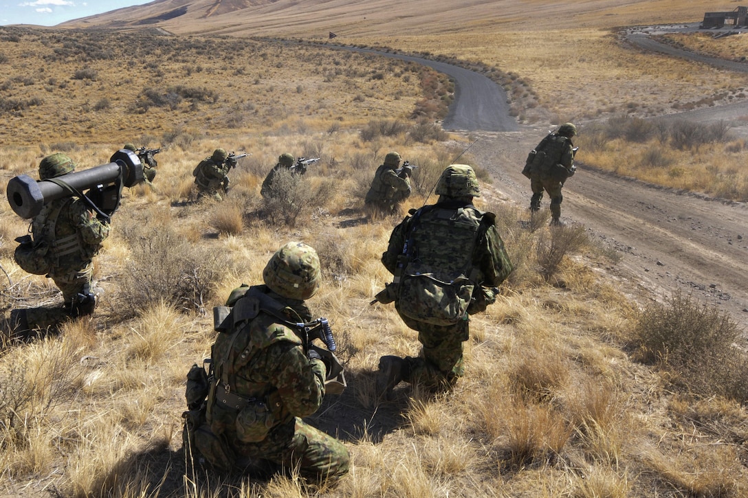 Japanese soldiers assault a village during the culminating live-fire exercise of Exercise Rising Thunder at Yakima Training Center, Wash., Sept. 21, 2015. The Japanese soldiers are assigned to the Japan Ground Self-Defense Force. U.S. Army photo by Sgt. Eliverto Larios
