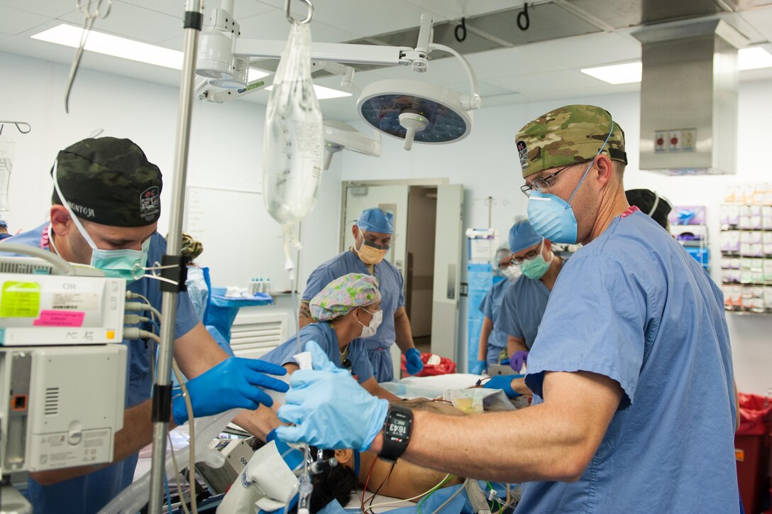 U.S. Airmen assigned to the 455th Expeditionary Medical Group prep an Afghan National Defense and Security Forces soldier who sustained trauma from a gunshot for surgery at the Craig Joint Theater Hospital, Bagram Airfield Afghanistan, Sept. 26, 2015. The CJTH provides surgical capabilities in trauma, general surgery, orthopedics, neurosurgery, urology, vascular surgery and otolaryngology, all of which are critical to helping 98 percent of patients who come to the hospital survive their injuries. (U.S. Air Force photo by Tech. Sgt. Joseph Swafford/Released)