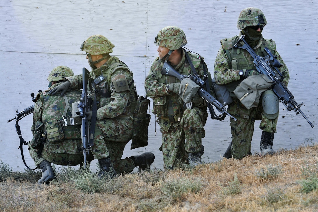 Japanese soldiers prepare to clear a building during the culminating live-fire exercise of Exercise Rising Thunder at Yakima Training Center, Wash., Sept. 21, 2015. The Japanese soldiers are assigned to the Japan Ground Self-Defense Force. U.S. Army photo by Sgt. Eliverto Larios
