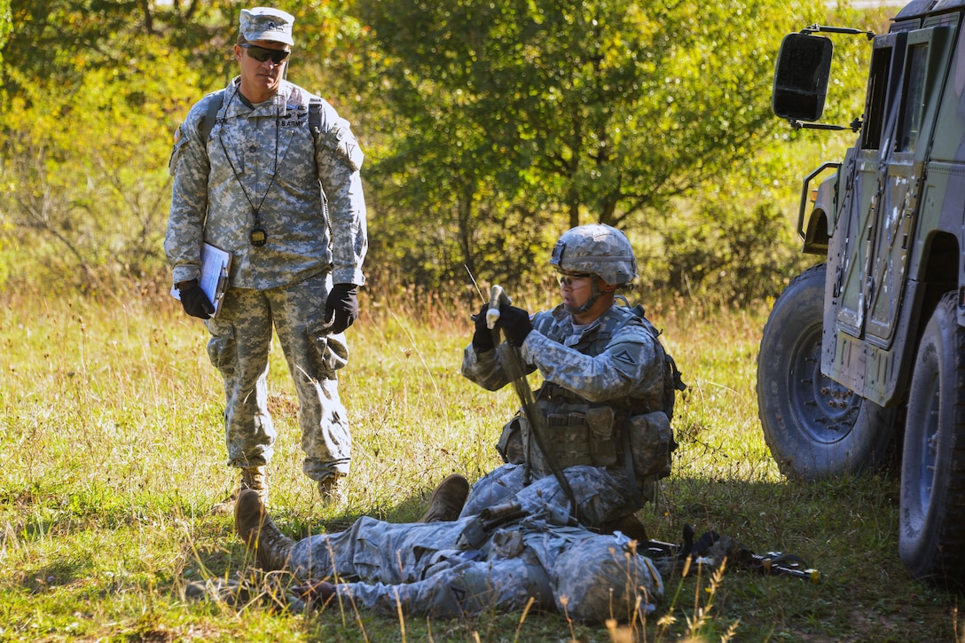 A U.S. Army Expert Infantryman Badge candidate stationed on the Joint Multinational Readiness Center performs first aid on a simulated casualty during the competition on the Hohenfels Training Area, Germany, Sept. 29, 2015. U.S. Army photo by Markus Rauchenberger
