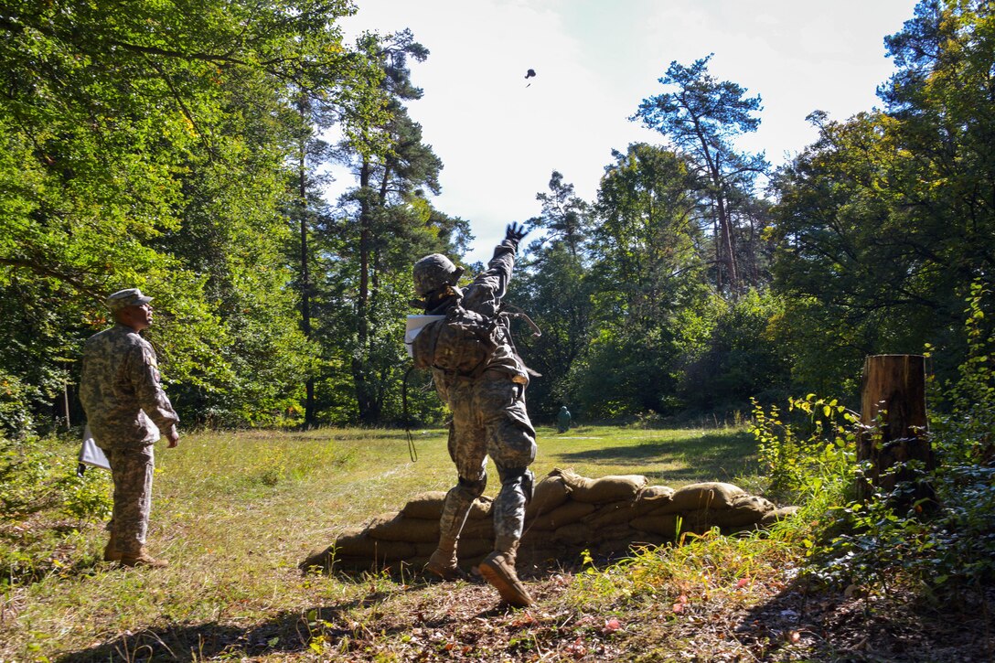 A U.S. Army Expert Infantryman Badge candidate stationed on the Joint Multinational Readiness Center throws a hand grenade during the  competition on the Hohenfels Training Area, Germany, Sept. 29, 2015. U.S. Army photo by Markus Rauchenberger