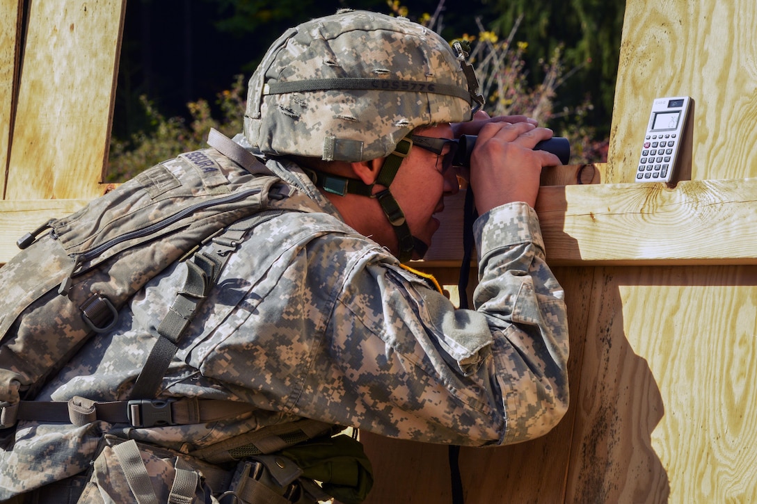 A U.S. Army Expert Infantryman Badge candidate, stationed at the Joint Multinational Readiness Center conducts range estimation during the  competition at the Hohenfels Training Area, Germany, Sept. 29, 2015. U.S. Army photo by Markus Rauchenberger