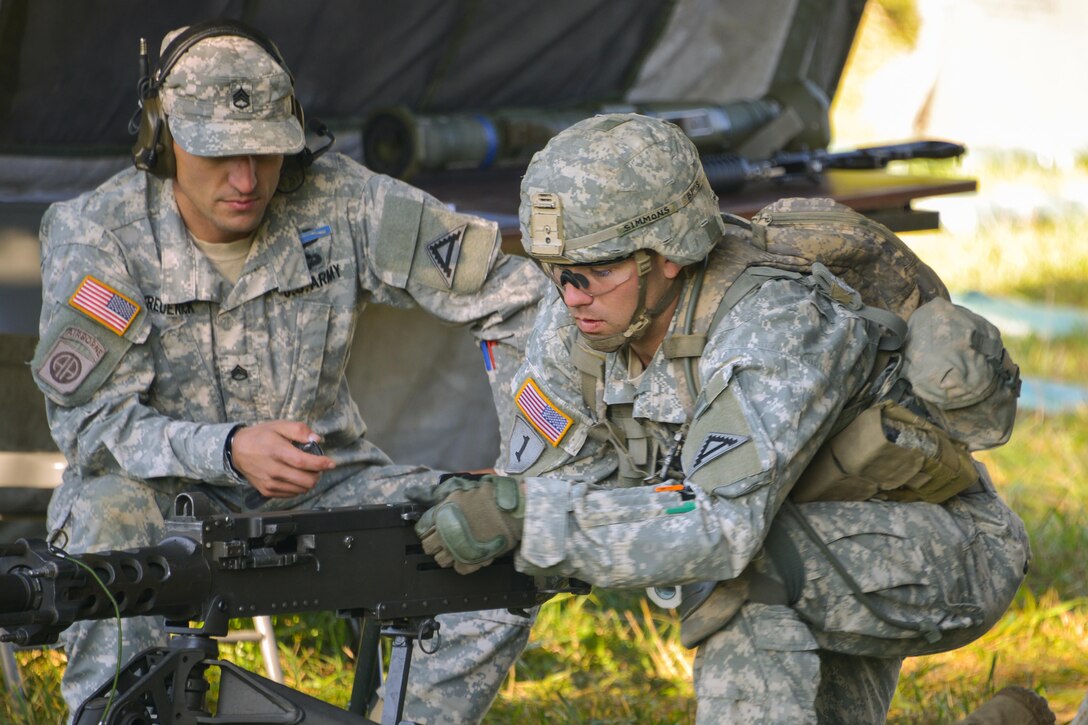 A U.S. Army Expert Infantryman Badge candidate stationed on the Joint Multinational Readiness Center conducts a function check on a M2-50.cal machine gun during the competition at the Hohenfels Training Area, Germany, Sept. 29, 2015. U.S. Army photo by Markus Rauchenberger