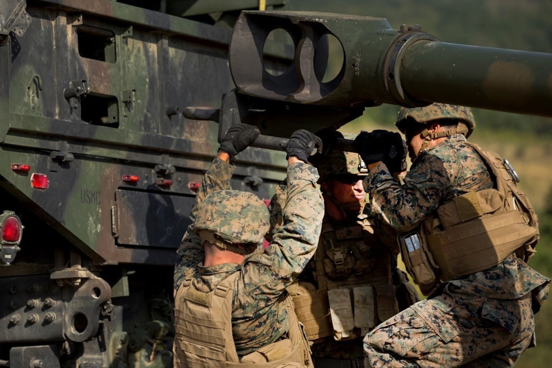 U.S. Marines prepare a M777-A2 howitzer during a direct-fire exercise at Novo Selo Training Area, Bulgaria, Sept. 22, 2015. U.S. Marine Corps photo by Lance Cpl. Melanye E. Martinez