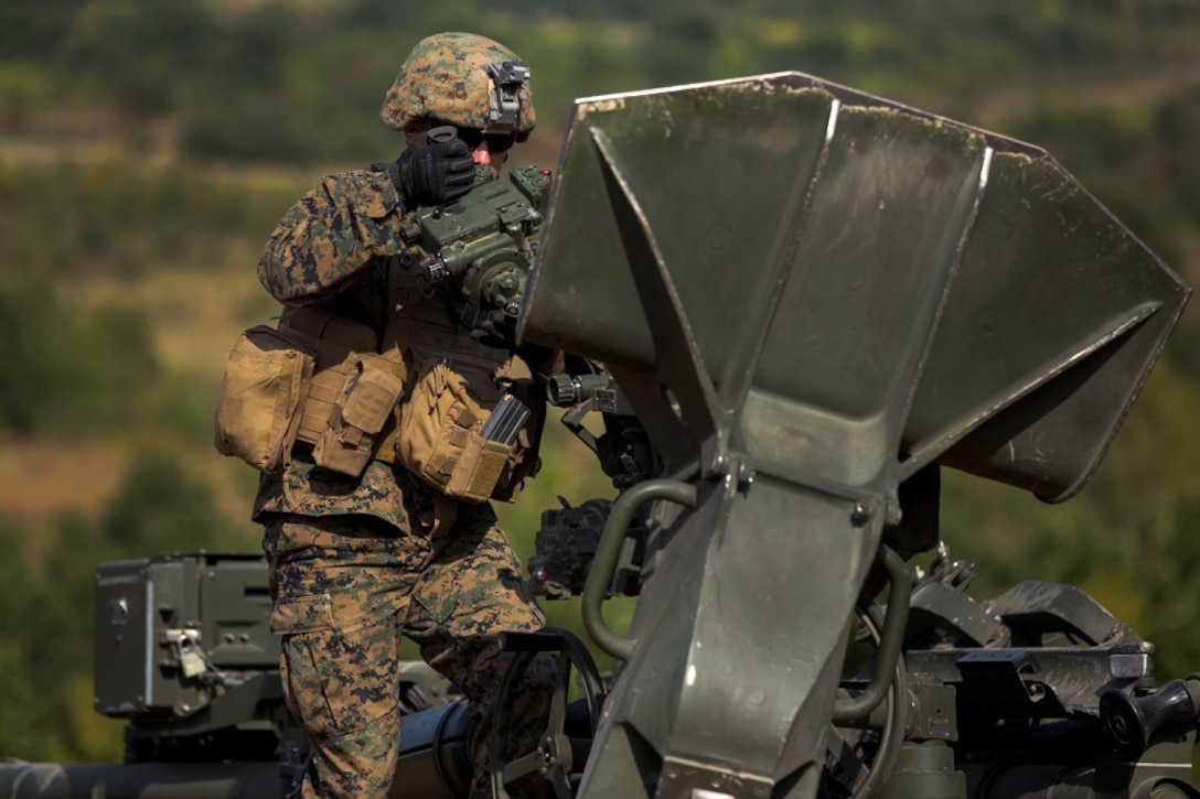 A U.S. Marine prepares a M777-A2 howitzer during a direct fire exercise at Novo Selo Training Area, Bulgaria, Sept. 22, 2015. U.S. Marine Corps photo by Lance Cpl. Melanye E. Martinez