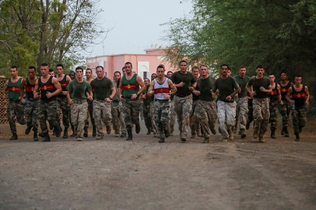 BASE AERIENNE 188, Djibouti (Sept. 21, 2015) U.S. Marines with the 15th Marine Expeditionary Unit and the French 5th Overseas Combined Arms Regiment (RIAOM) run five miles as part of indoctrination prior to participating in a desert survival course. Elements of the 15th MEU are  training with the 5th RIAOM in Djibouti in order to improve interoperability between the MEU and the French military. (U.S. Marine Corps photo by Sgt. Steve H. Lopez/Released)