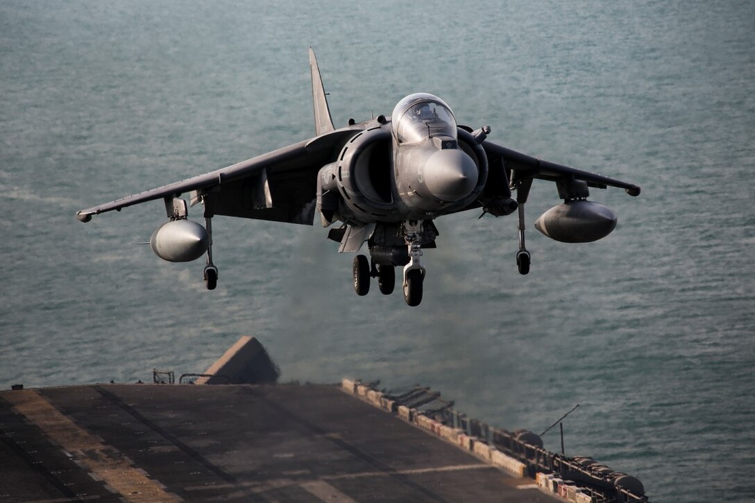 ARABIAN GULF (Sept. 29, 2015) An AV-8B Harrier with Marine Medium Tiltrotor Squadron 161 (Reinforced), 15th Marine Expeditionary Unit, lands aboard the amphibious assault ship USS Essex (LHD 2). The 15th Marine Expeditionary Unit, embarked aboard the ships of the Essex Amphibious Ready Group, is deployed to maintain regional security in the U.S. 5th Fleet area of operations. (U.S. Marine Corps photo by Cpl. Anna Albrecht/Released)