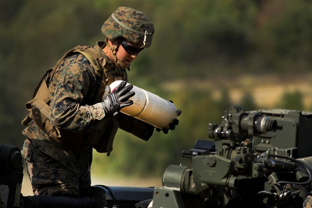 A U.S. Marine prepares an M777-A2 howitzer during a direct-fire exercise at Novo Selo Training Area, Bulgaria, Sept. 22, 2015. U.S. Marine Corps photo by Lance Cpl. Melanye E. Martinez