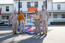U.S. Marine Corps Maj. Gen. Daniel J. O'Donohue (right), Commanding General of 1st Marine Division, and Sgt. Maj. William T. Sowers (left), Sergeant Major of 1st Marine Division, pose for a group photo with Samuel T. Holiday, and Roy Hawthorne during a visit to Marine Corps Base Camp Pendleton, Calif. Sept. 28, 2015. The Navajo code talkers took part in every assault the U.S. Marines conducted in the Pacific from 1942 to 1945. They served in all six Marine divisions, Marine Raider Battalions and Marine parachute units, transmitting messages by telephone and radio in their native language that enemy forces were never able to break. (U.S. Marine Corps photo by Lance Cpl. Adrianna R. Lincoln 1st Marine Division Combat Camera/Released)