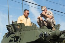 A U.S. Marine with 1st Light Armored Reconnaissance Battalion, 1st Marine Division, speaks with a member of the Navajo Nation about a Light Armored Vehicle during the Navajo Code Talker tour on Marine Corps Base Camp Pendleton, Calif., Sept. 28, 2015. The Navajo code talkers took part in every assault the U.S. Marines conducted in the Pacific from 1942 to 1945. They served in all six Marine divisions, Marine Raider Battalions and Marine parachute units, transmitting messages by telephone and radio in their native language that enemy forces were never able to break. (U.S. Marine Corps photo by Lance Cpl. Adrianna R. Lincoln 1st Marine Division Combat Camera/ Released)