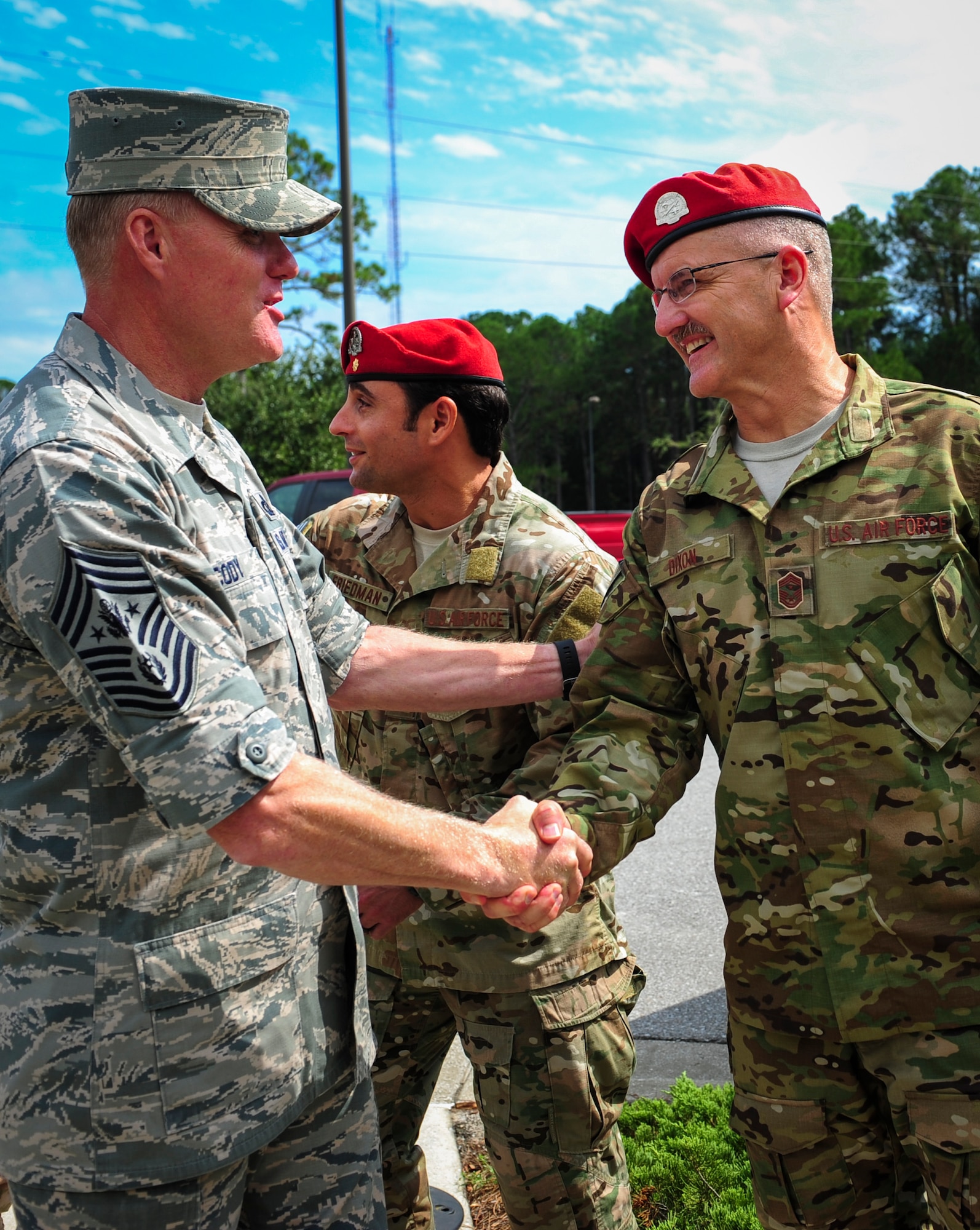 Chief Master Sgt. Bruce Dixon, right, 24th Special Operations Wing command chief, welcomes Chief Master Sgt. of the Air Force James A. Cody during a tour on Hurlburt Field, Fla., Sept. 29, 2015. (U.S. Air Force photo by Senior Airman Meagan Schutter)