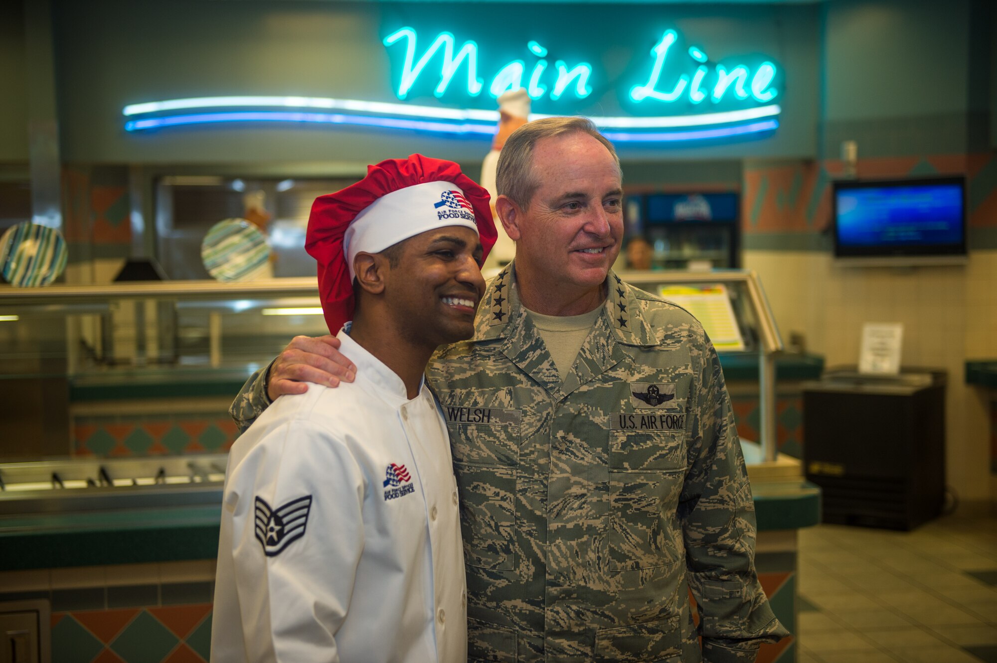 Air Force Chief of Staff Gen. Mark A. Welsh III poses for a photo with Staff Sgt. Raymond Soto-Pacheco, 1st Special Operations Force Support Squadron services craftsman, before having lunch with Air Force Special Operations Command Airmen at the Riptide Dining Facility at Hurlburt Field, Fla., Sept. 30, 2015. (U.S. Air Force photo by Airman Kai White)