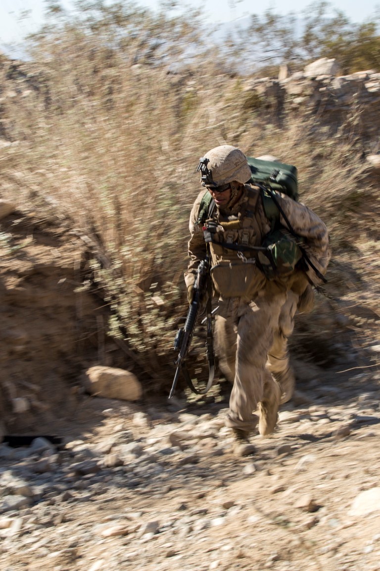 A Marine with Company “F”, 2nd Battalion, 1st Marine Regiment, maneuvers to his next objective during a live fire company assault as part of Realistic Urban Training Exercise (RUTEX) at range 400 aboard Marine Corps Air Ground Combat Center Twenty-nine Palms, Calif, Sept. 5, 2015. RUTEX provides Marines and Sailors of the 13th Marine Expeditionary Unit (13th MEU) an opportunity to perform and practice their duties while deployed in an urban environment. (U.S. Marine Corps photo by Sgt Hector de Jesus/Released)
