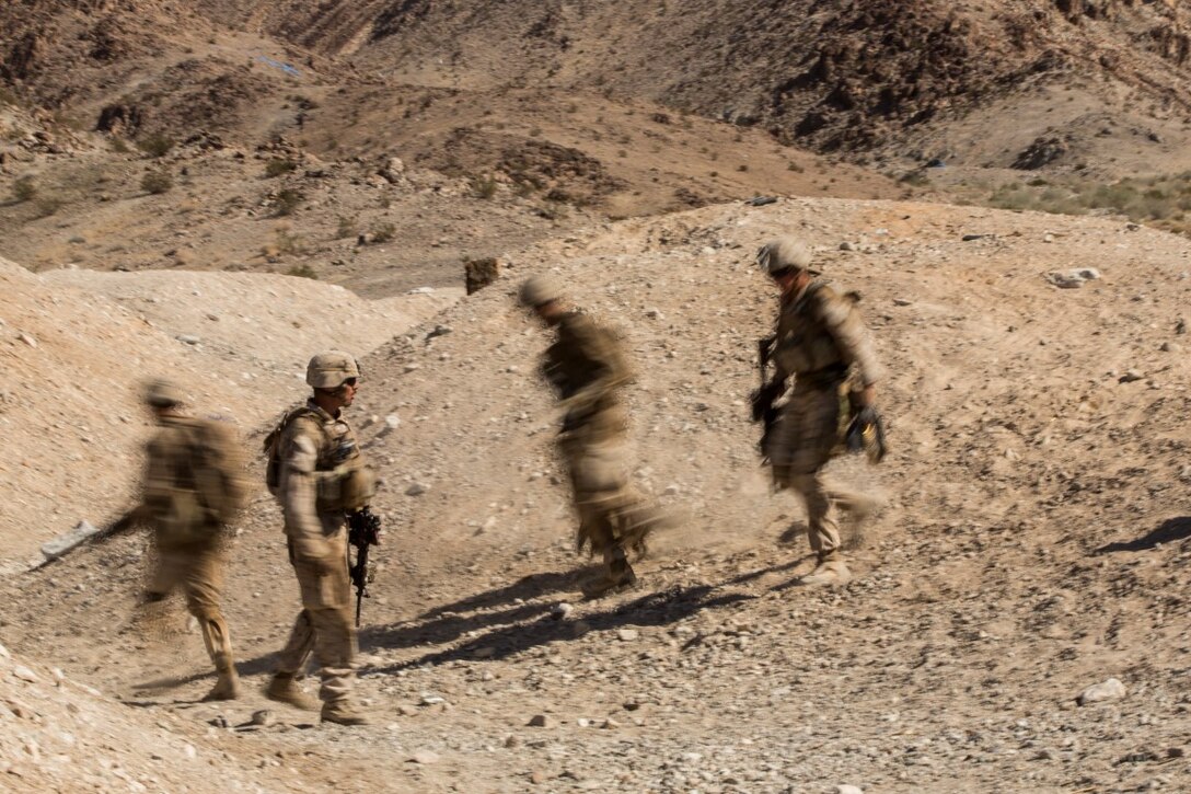 Marines with Company “F”, 2nd Battalion, 1st Marine Regiment, maneuver to their next fighting position during a live fire company assault as part of Realistic Urban Training Exercise (RUTEX) at range 400 aboard Marine Corps Air Ground Combat Center Twenty-nine Palms, Calif., Sept. 5, 2015. RUTEX provides Marines and Sailors of the 13th Marine Expeditionary Unit (13th MEU) an opportunity to perform and practice their duties while deployed in an urban environment. (U.S. Marine Corps photo by Sgt Hector de Jesus/Released)
