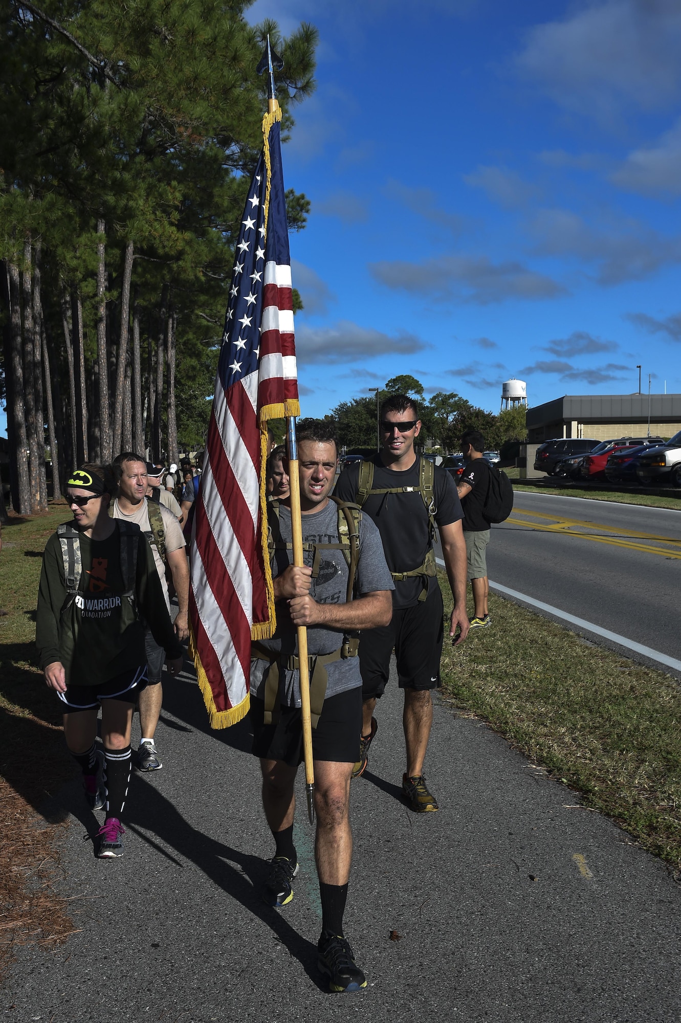 Airmen participate in a team cohesion challenge at Hurlburt Field, Fla., Sept. 25, 2015. The event challenges a group of Airmen to work together as a team to complete a task. (U.S. Air Force photo by Senior Airman Jeff Parkinson)