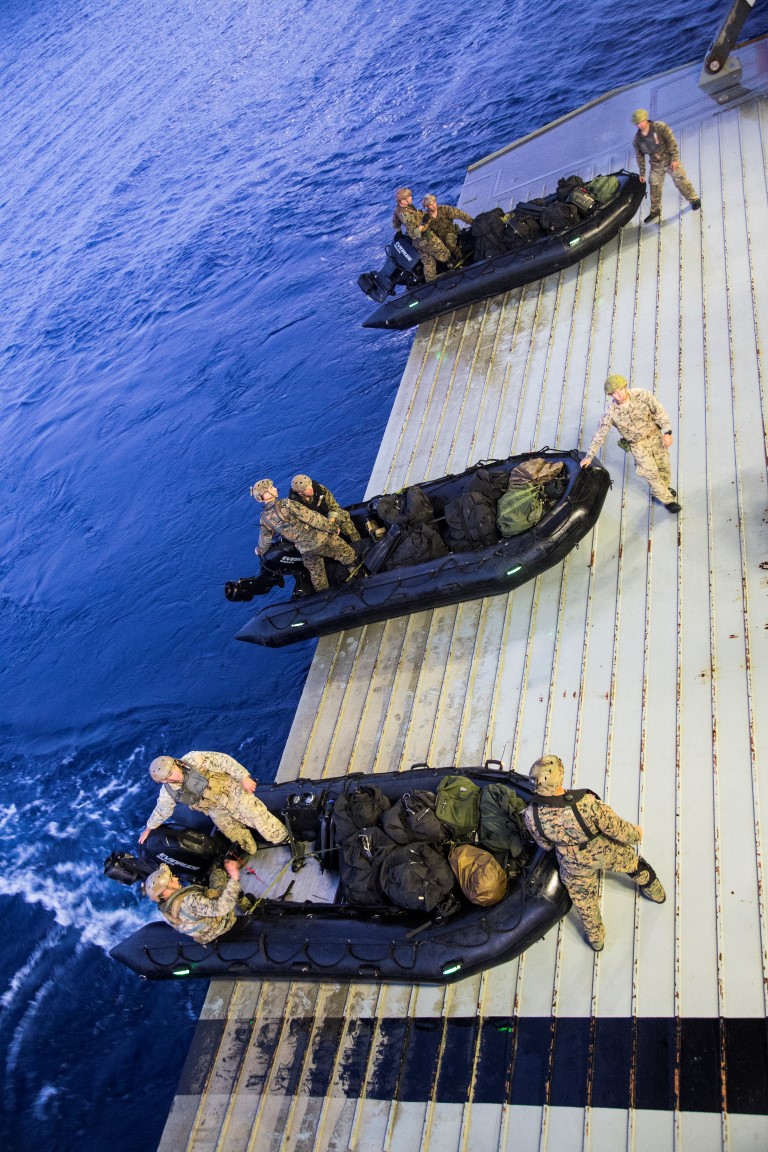 U.S. Marines with the Maritime Raid Force, 13th Marine Expeditionary Unit (MEU), 1st Marine Expeditionary Force, disembark from the USS New Orleans utilizing a combat rubber raid craft during the PHIBRON-MEU integration exercise off the coast of San Clemente Island, Sept. 25, 2015. This marks the first at-sea exercise for the PHIBRON-MEU Marines and Sailors as they work together in preparation for deployment to the Pacific and Central Command areas of responsibility in early 2016. (U.S. Marine Corps photo by Sgt. Tyler C. Gregory/released)
