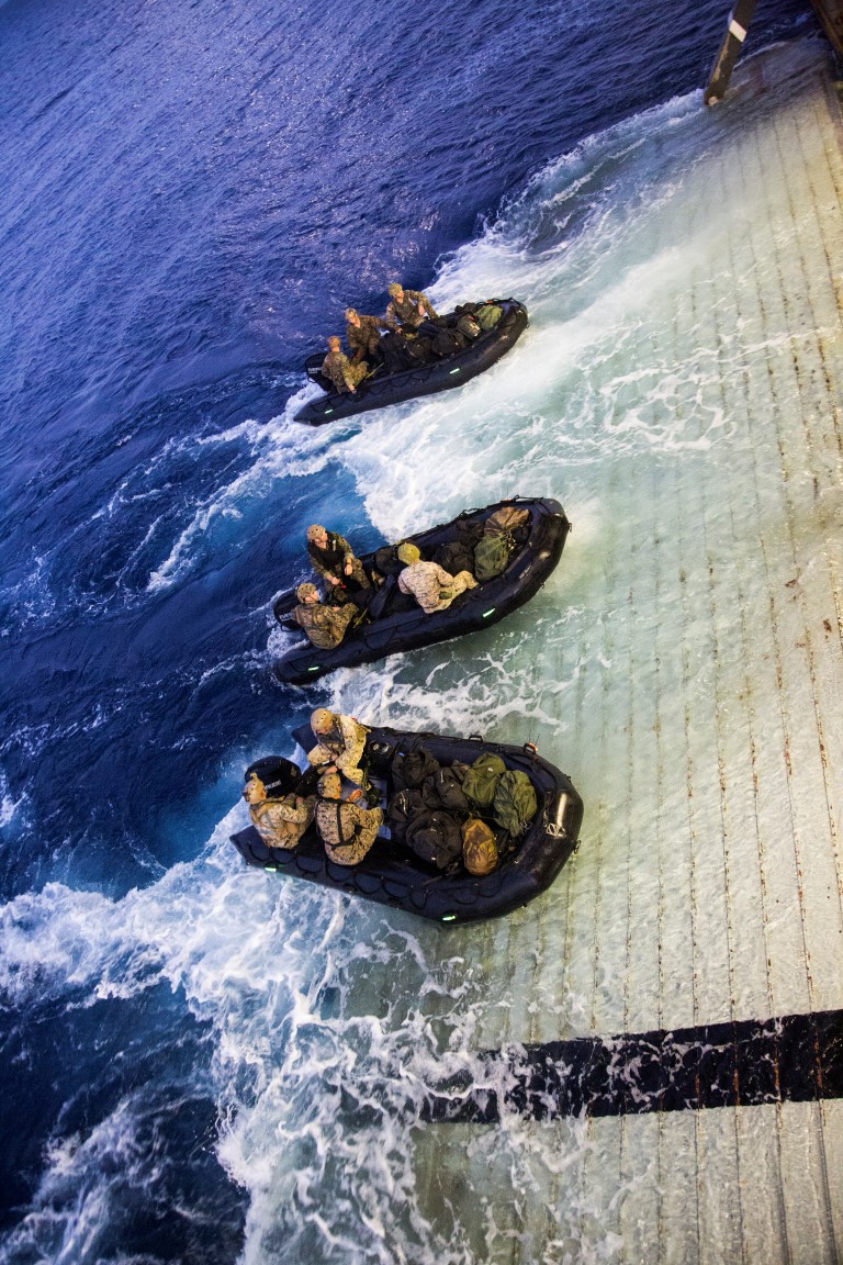 U.S. Marines with the Maritime Raid Force, 13th Marine Expeditionary Unit (MEU), 1st Marine Expeditionary Force, disembark from the USS New Orleans utilizing a combat rubber raid craft during the PHIBRON-MEU integration exercise off the coast of San Clemente Island, Sept. 25, 2015. This marks the first at-sea exercise for the PHIBRON-MEU Marines and Sailors as they work together in preparation for deployment to the Pacific and Central Command areas of responsibility in early 2016. (U.S. Marine Corps photo by Sgt. Tyler C. Gregory/released)