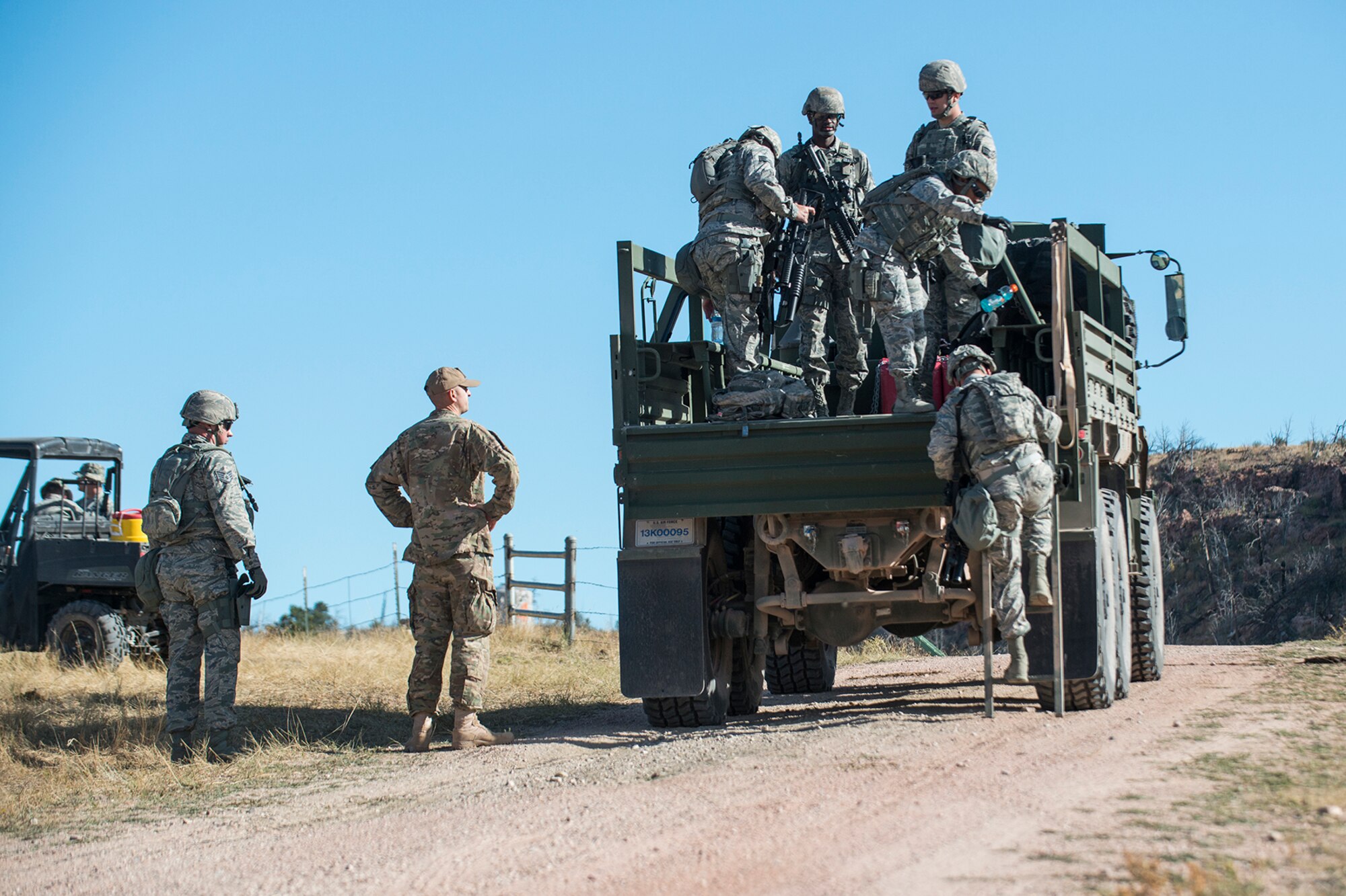 The 307th Security Forces competition team arrives to compete in the Mental and Physical (MAP) Challenge on Sept. 22, 2015, Camp Guernsey Joint Training Center, Wyo. The MAP Challenge is a timed event, where teams used their land navigation skills to reach check points, testing their team work and ability to complete objectives under harsh and stressful conditions. (U.S. Air Force photo by Master Sgt. Greg Steele/Released)	