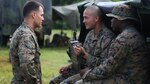 Cpl. Seth Dixon (left), a field radio operator with 3rd Battalion, 3rd Marine Regiment, and Blue Ridge, Ga., native, speaks to Cpl. Terry Summerfield (center), a technician with 3rd Bn., 3rd Marines, and San Diego native, and Cpl. John Boyd (right), a field radio operator with 3rd Bn., 3rd Marines, and Lagrange, Ga., native, at the Boondocker Training Area aboard Marine Corps Base Hawaii during training exercise Island Viper, Sept. 22, 2015. The purpose of Island Viper was to help companies within the battalion ensure their service members have been properly trained and have met all training requirements before deployment. 