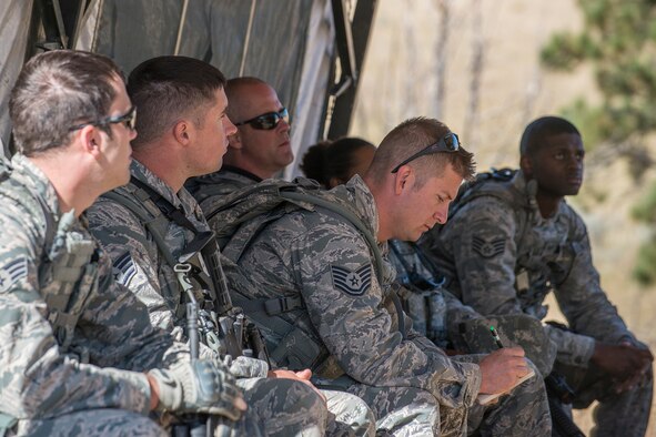 U.S. Air Force Tech. Sgt. Johnathan Maupin takes notes as his team is read the rules for the Mental and Physical Challenge on Sept. 22, 2015, Camp Guernsey Joint Training Center, Wyo. Maupin is the leader of the six-person team and all are assigned to the 307th Security Forces Squadron at Barksdale Air Force Base, La. (U.S. Air Force photo by Master Sgt. Greg Steele/Released)