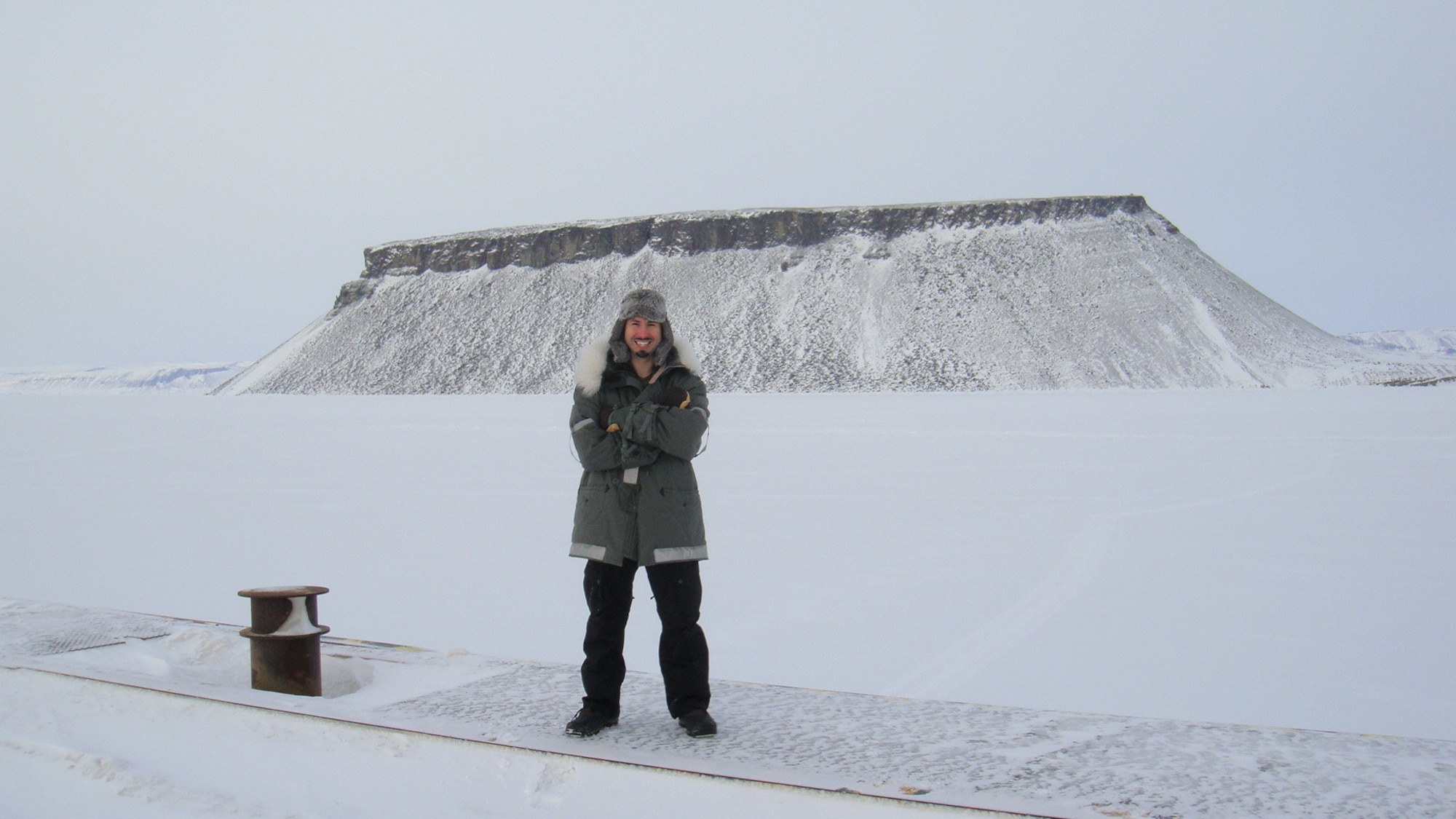 Mentalist/illusionist/comedian Matt the Knife poses in front of Mount Dundas on a tour stop at Thule Air Base, Greenland, in March 2011. (Courtesy photo/Matt The Knife)