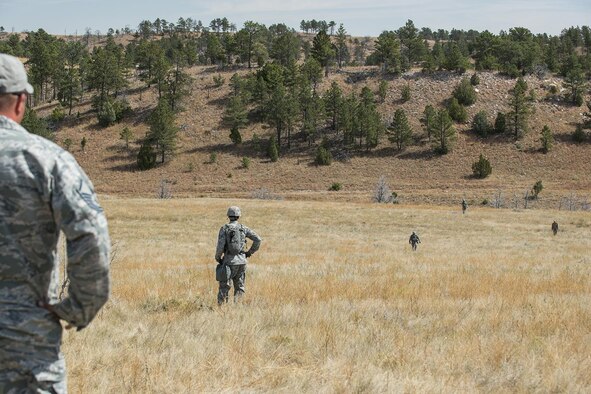A monitor for the Global Strike Challenge waits at a checkpoint for the arrival of the 307th Security Forces Squadron competition team on Sept. 22, 2015, Camp Guernsey Joint Training Center, Wyo. The team is participating in the Mental and Physical Challenge, which is one of four events scheduled during the Air Force Global Strike Challenge. (U.S. Air Force photo by Master Sgt. Greg Steele/Released)