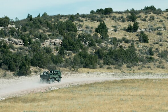 Members of the 307th Security Forces Squadron depart the competition area of the Mental and Physical (MAP) Challenge on Sept. 22, 2015, Camp Guernsey Joint Training Center, Wyo. The MAP Challenge is a timed event, where Security Forces teams use their land navigation skills to reach check points, testing their team work and ability to complete objectives under harsh and stressful conditions. (U.S. Air Force photo by Master Sgt. Greg Steele/Released)