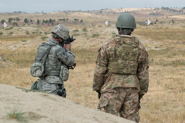 A member of the 307th Security Forces Squadron fires his M4 rifle during the Weapons Firing Challenge on Sept. 23, 2015, Camp Guernsey Joint Training Center, Wyo. The challenge consists of teams being evaluated on their marksmanship using the M4 rifle, M9 pistol, M240 machine gun and the M203 grenade launcher. (U.S. Air Force photo by Master Sgt. Greg Steele/Released)