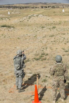 A member of the 307th Security Forces Squadron fires his M9 pistol during the Weapons Firing Challenge on Sept. 23, 2015, Camp Guernsey Joint Training Center, Wyo. The challenge consists of teams being evaluated on their marksmanship using the M4 rifle, M9 pistol, M240 machine gun and the M203 grenade launcher. (U.S. Air Force photo by Master Sgt. Greg Steele/Released)